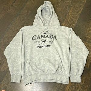 Grey hoodie from Vancouver. Has some wording and other characteristics.